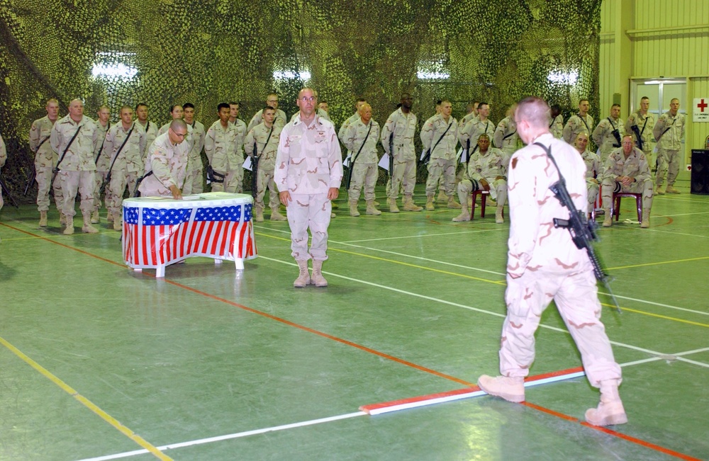 A Task Force Liberty Soldier steps over the line