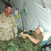 SMA Preston visits with PVT Ogura at the Air Force Theatre Hospital