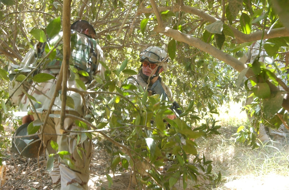 Pfc. Marston provides security for an interpreter working with coalition fo