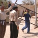 A worker from Balad General Hospital moves a bed