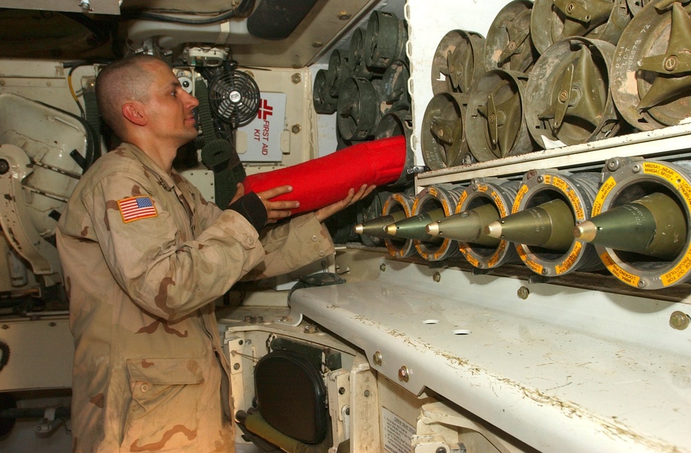 Pfc. Andrew Ponton restocks the paladin powder storage container