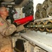 Pfc. Andrew Ponton restocks the paladin powder storage container