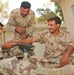 Iraqi Soldiers practice splinting a broken arm