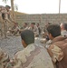 Spc. Dominic Italiano teaches an Iraqi combat life saver class
