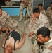 An Iraqi medic teaches a class on treating sucking chest wounds