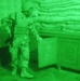 An Iraqi Soldier searches a room