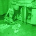 An Iraqi Soldier searches a room