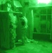 Iraqi Soldiers search through a closet in a house