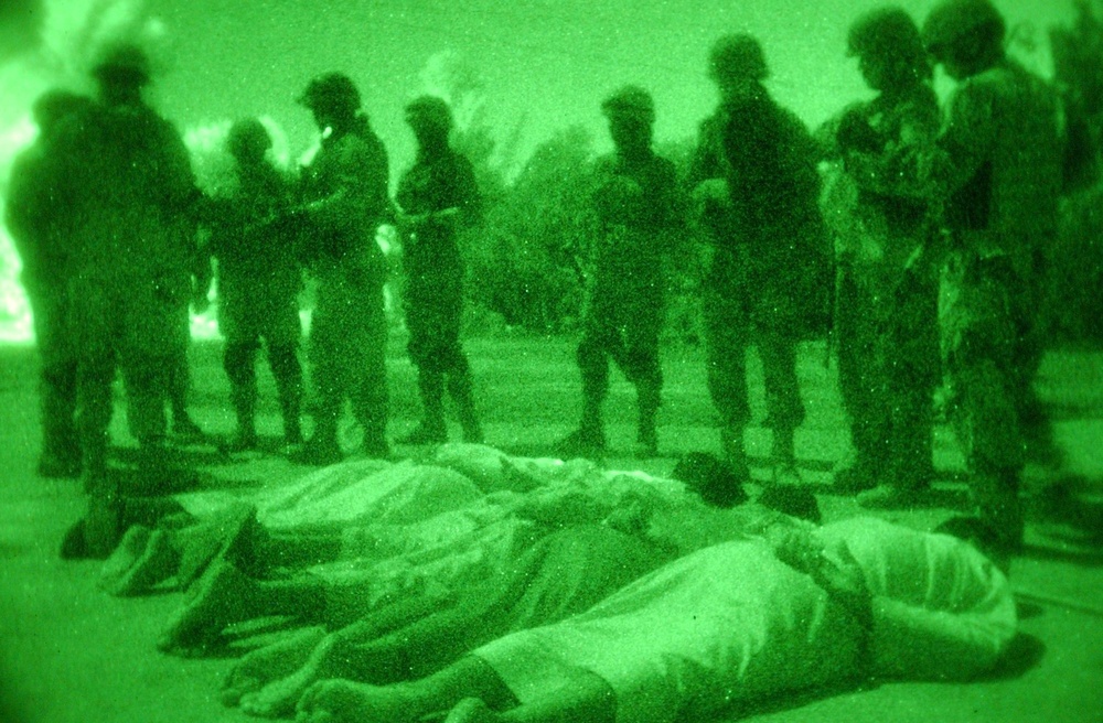 Iraqi Soldiers secure the males from an Iraqi household