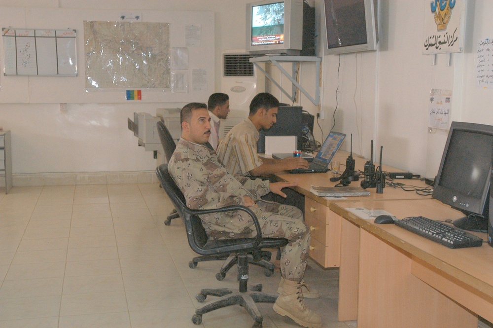 An Iraqi Soldier watches the news in the Balad Joint Coordination Center