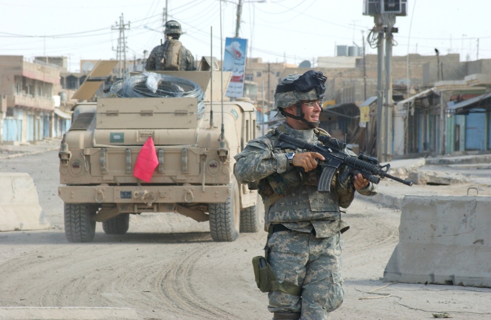 Staff Sgt. Fox pulls security in an intersection in Tall Afar