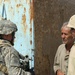 Capt. Adamczyk speaks with a resident of Tall Afar