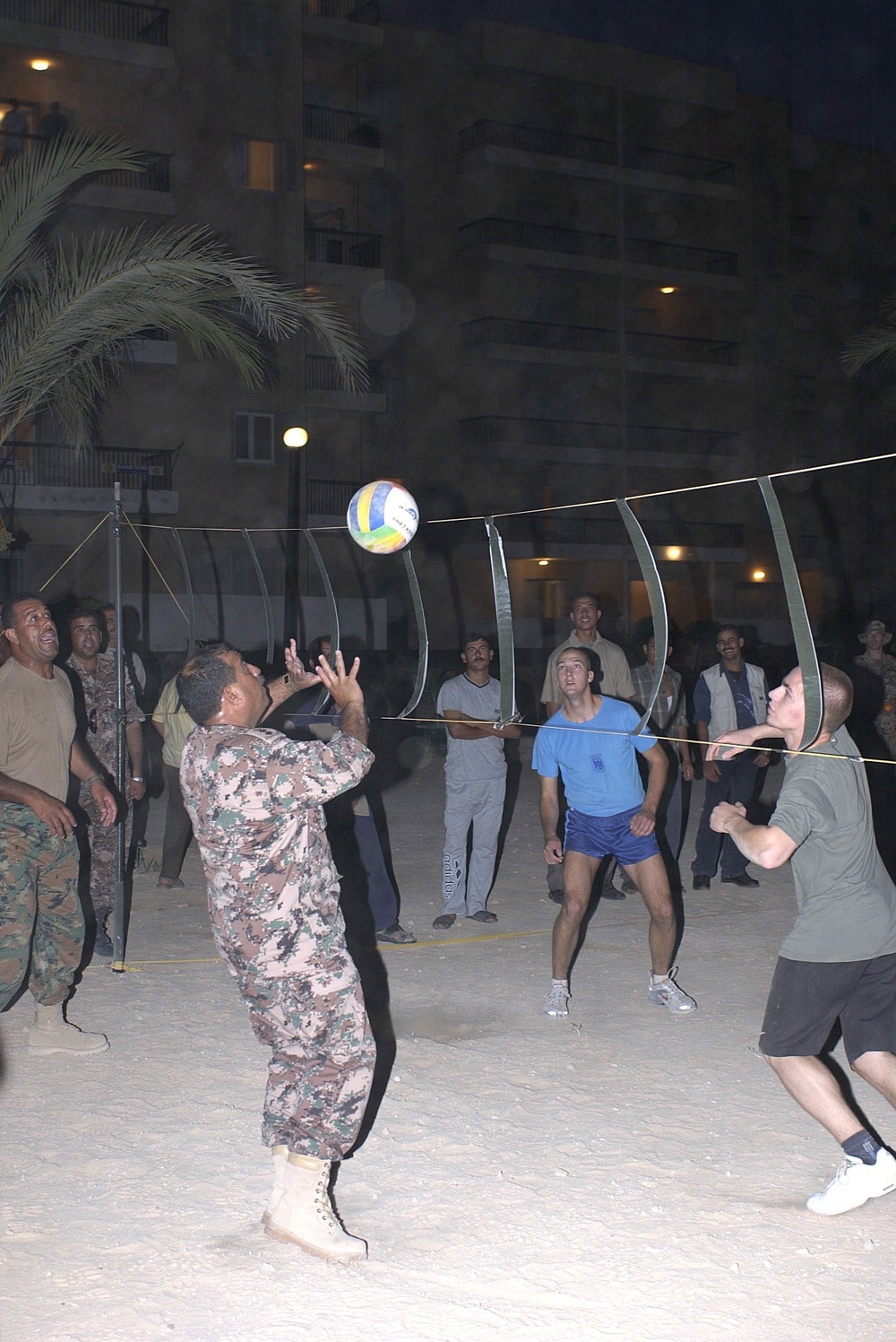 A Jordanian soldier volleys the ball