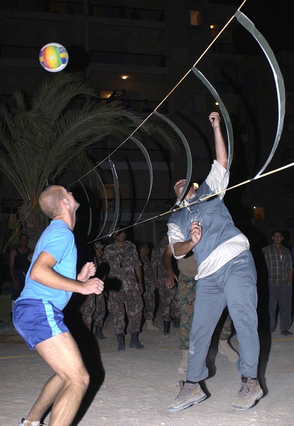 A Jordanian soldier hits a serving ball back to the opposing team