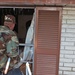 A Soldier searches a house