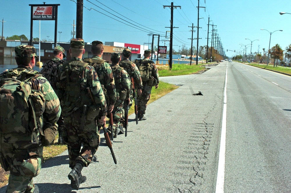 Ohio Army National Guard Soldiers march down a road