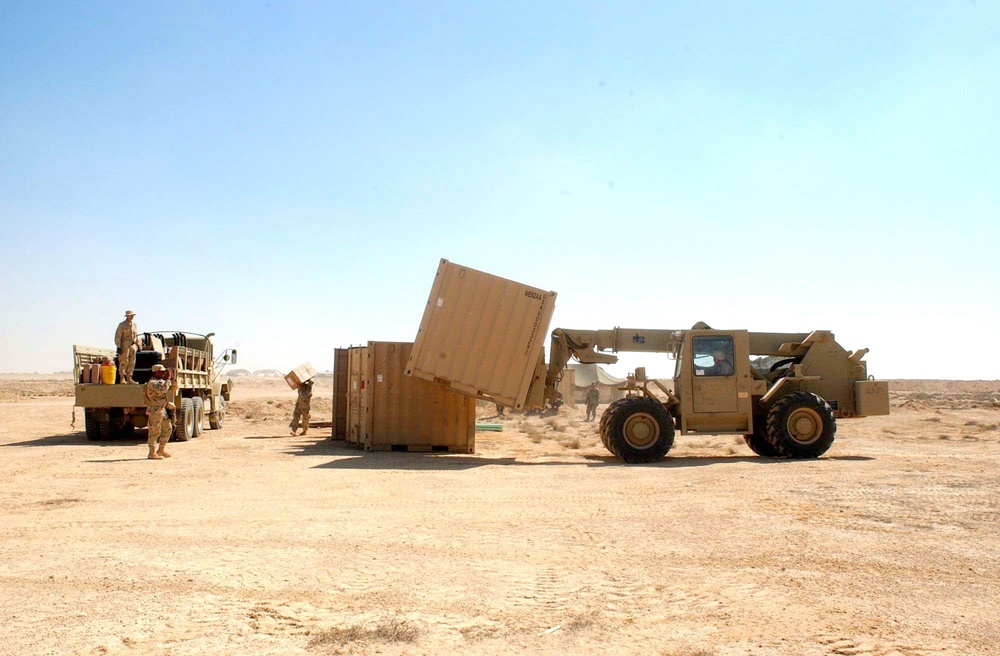 A forklift lines-up storge units