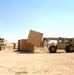 A forklift lines-up storge units