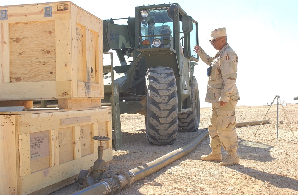 US Soldiers position crates of equipment