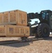 US Soldiers position crates of equipment