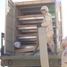 US Soldiers unload hoses and other equipment