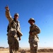 US Soldiers survey a construction site