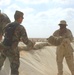 US Soldiers place sandbags at a fueling point