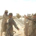 US Soldiers place sandbags at a fueling point