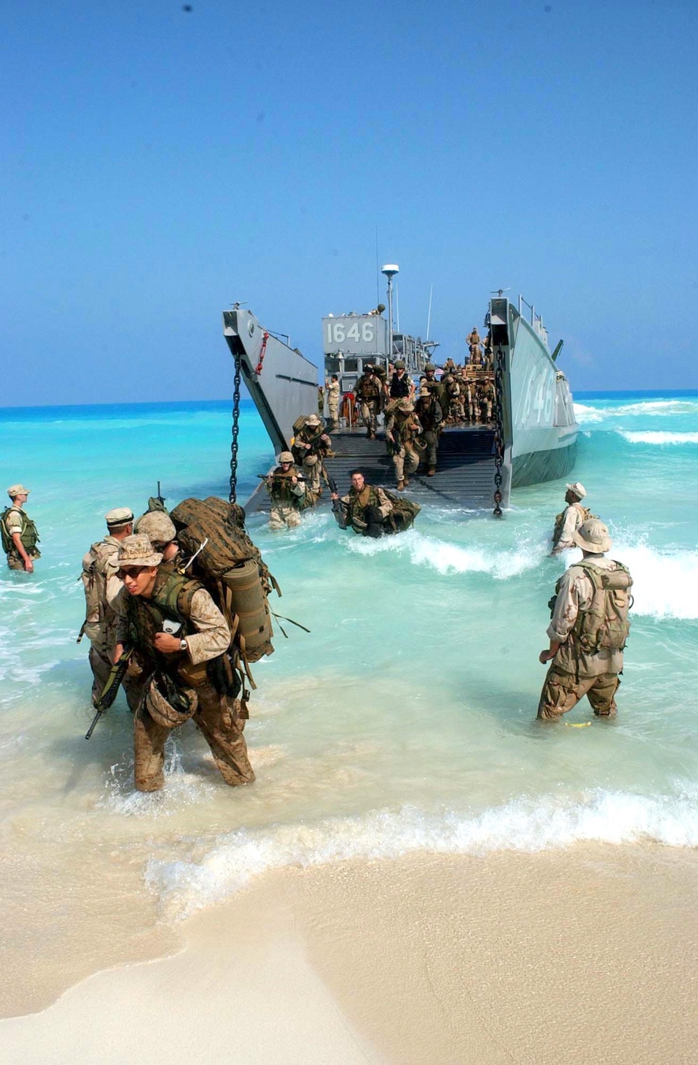 U.S. Marines disembark a landing craft utility ship