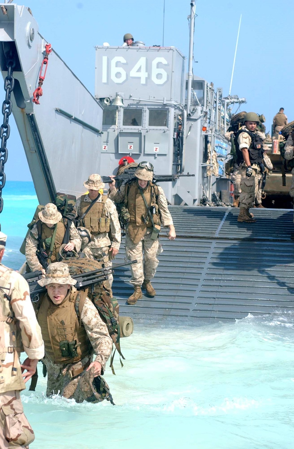 U.S. Marines disembark a landing craft utility ship