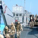 U.S. Marines disembark a landing craft utility ship