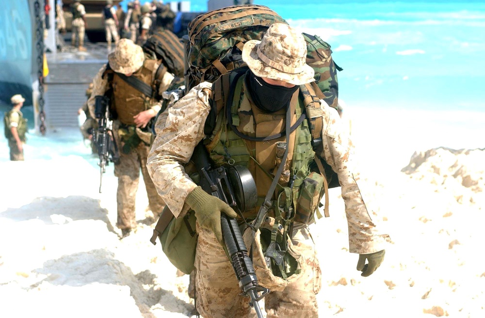 U.S. Marines disembark a landing craft utility ship