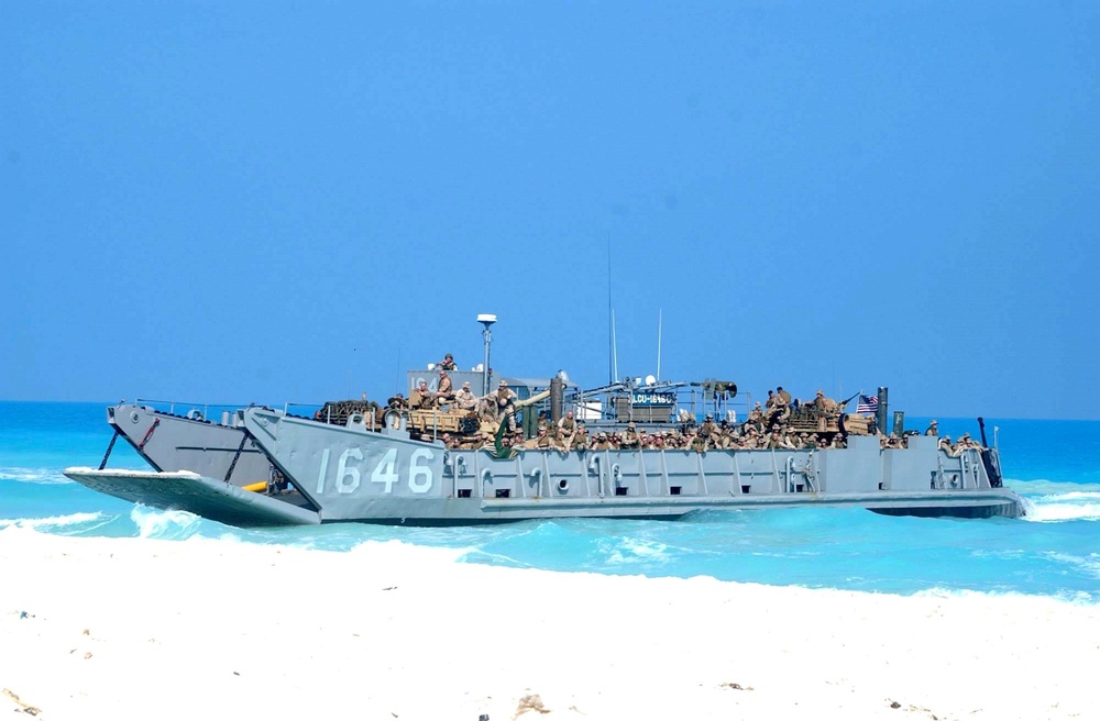 U.S. Marines disembark a landing craft utility ship