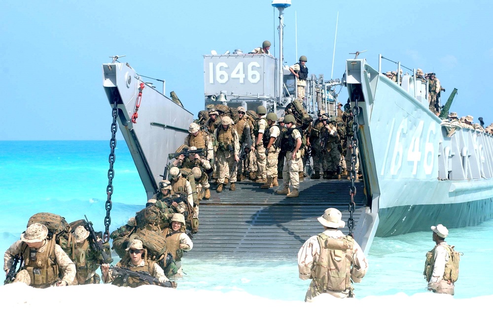 U.S. Marines disembark a landing craft utility ship