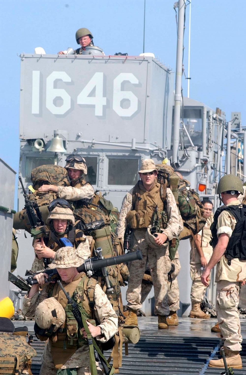 U.S. Marines disembark a landing craft utility ship