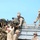 U.S. Marines load their excess gear unto a truck