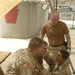 Medics and chaplain console a Soldier