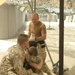 Medics and chaplain console a Soldier