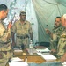 An Iraqi Lt. Col. directs fellow officers during a command post exercise