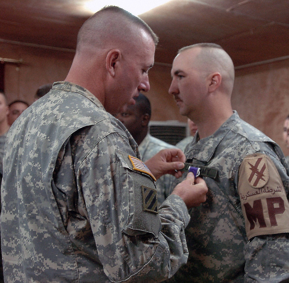 Staff Sgt. David Hatton receives the Purple Heart