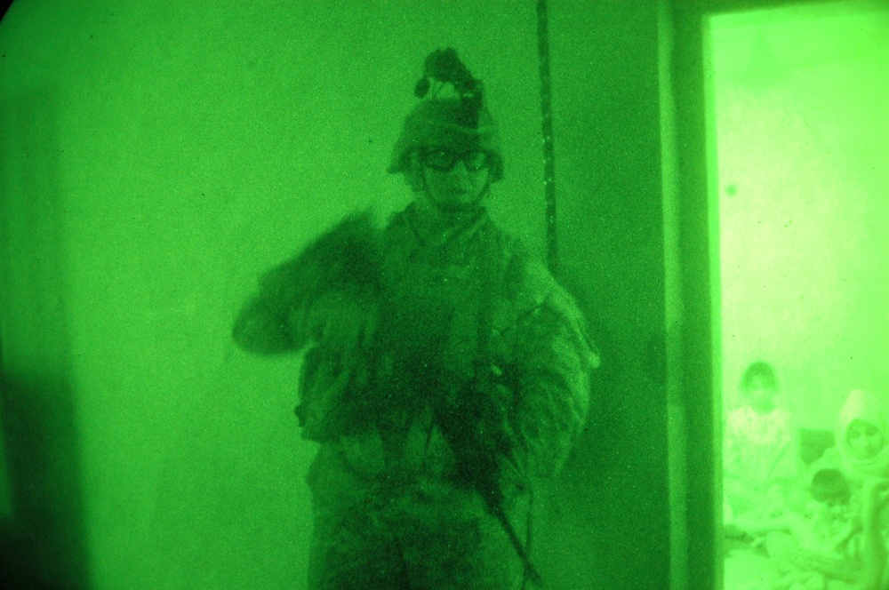 Maj. Dickerson stands watch during a night operation