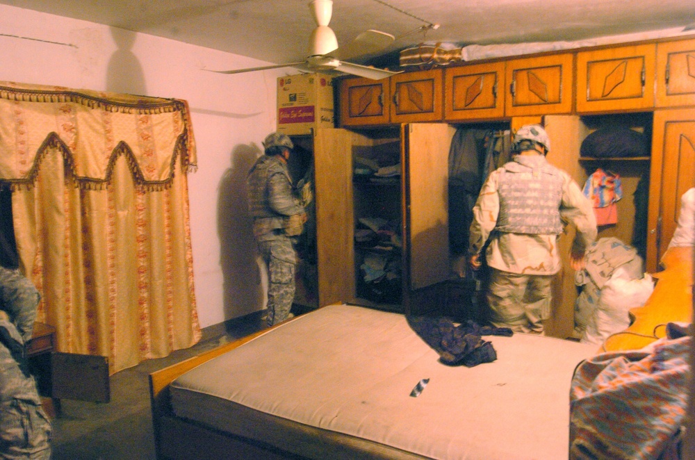 Soldiers search a room