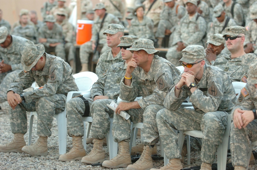 Soldiers sit deep in thought during