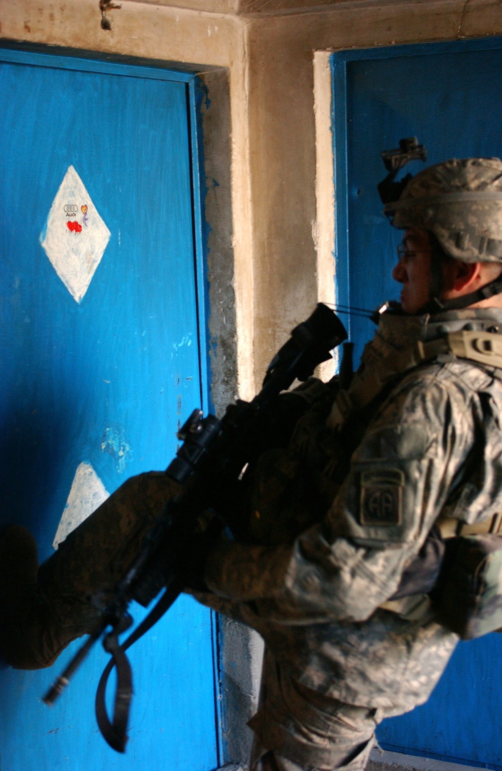 Sgt. Gabriel Joshua Herrera kicks in a door