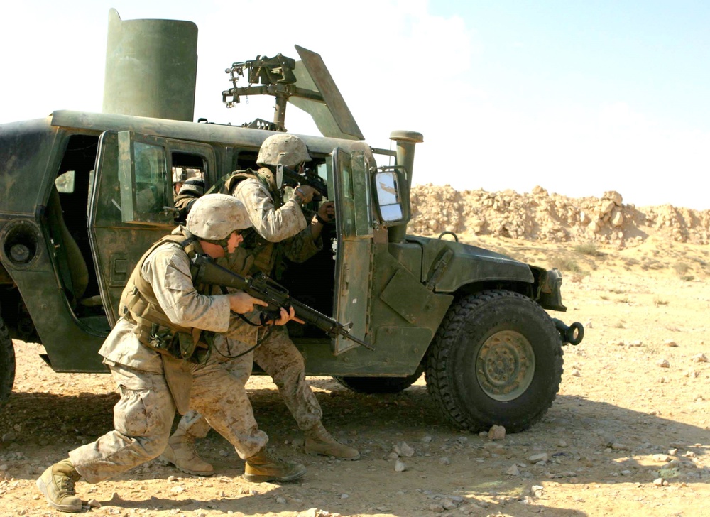 Sergeant Potvin and Lance Cpl. Louise Dismount Their HMMWV