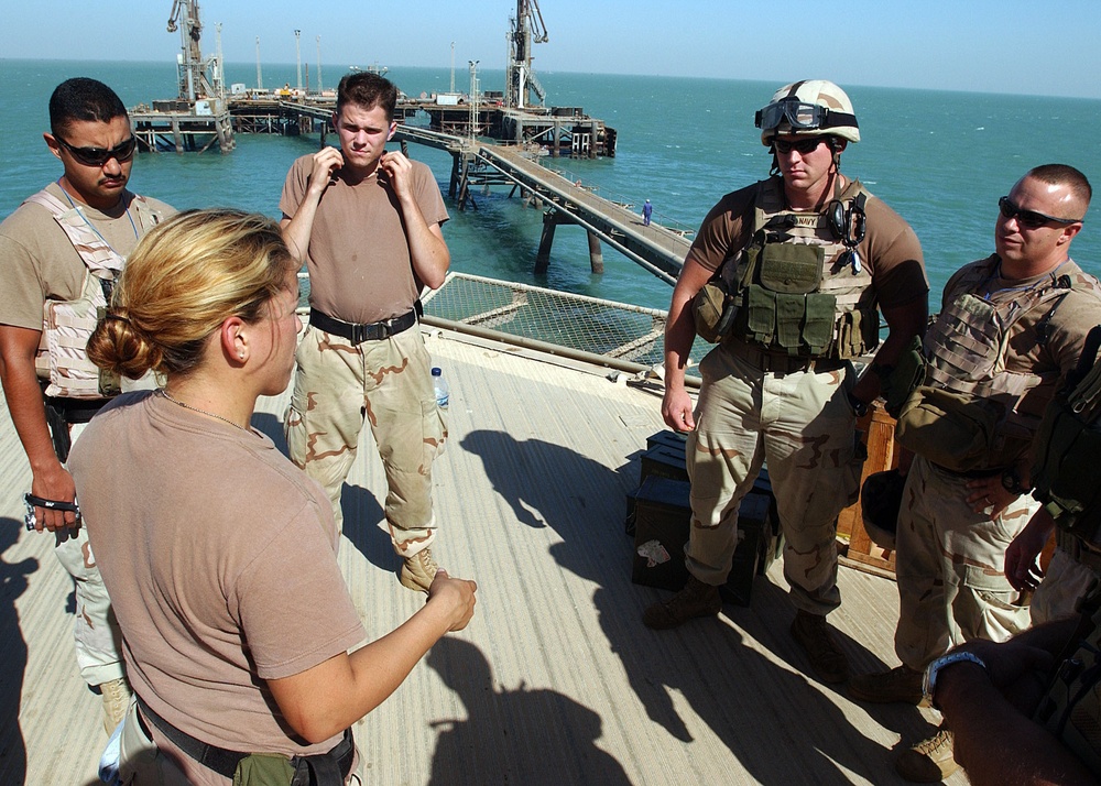 Gunner's Mate 2nd Class Elizabeth Campos gives a safety brief