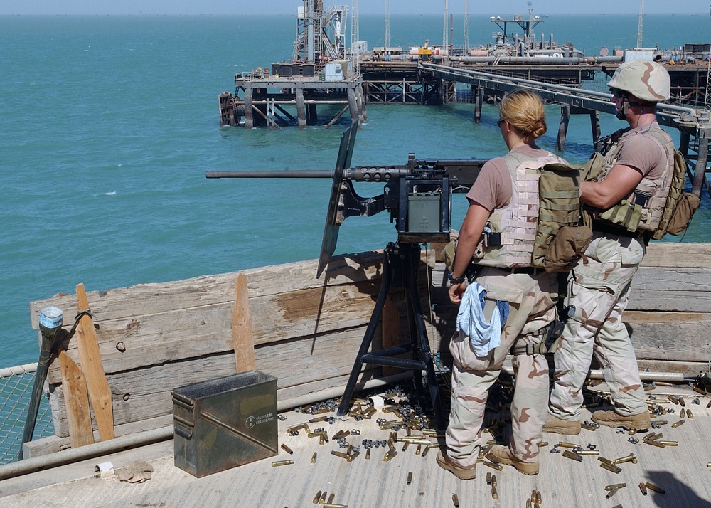 Gunner's Mate 2nd Class Elizabeth Campos ensures the .50 caliber mac