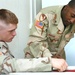 SSG Moore goes over study materiel with SPC Woodbury
