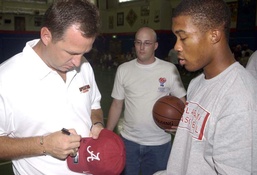Coach Gottfried autographs a hat