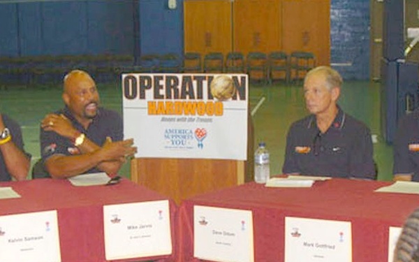 NCAA coaches speak to reporters during a press conference
